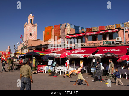 MARRAKESH, MOROCCO - Acrobats tumbling in front of cafe, Djemaa el-Fna main square in the medina. Stock Photo