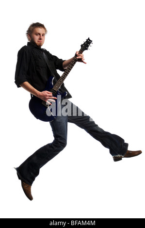 Musician playing the guitar and jumping isolated on a white background Stock Photo