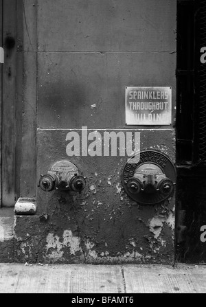 New York, fire sprinkler attachment points on the outside of the building Stock Photo