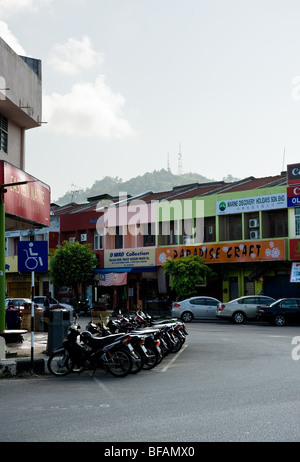 A row of motorbikes parked on a street in Kuah Town in Langkawi, Malaysia.  Photo by Gordon Scammell Stock Photo