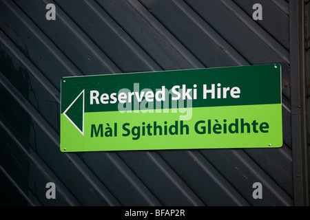 BiLingual gaelic Signs,  Reserved Ski Hire at the Glenshee Scottish Ski Centre, Braemar, Aberdeenshire, Scotland, UK Stock Photo