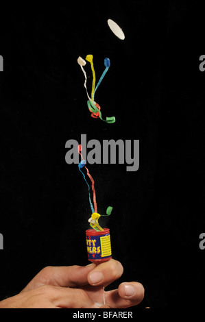 Party popper popping Stock Photo