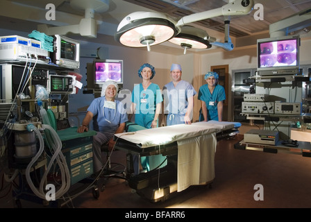 Surgeons operating in operation theater room Stock Photo - Alamy