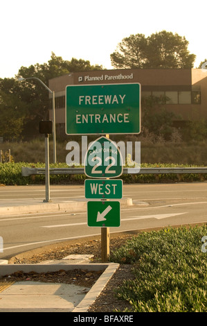 Sign for the 22 freeway (Garden Grove Freeway) in Orange, CA with the Planned Parenthood building visible in the background. Stock Photo