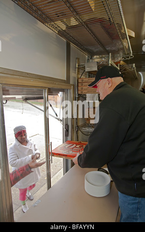 Little Caesar's pizza chain serves pizza to needy Detroit residents Stock Photo