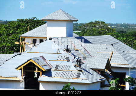 Men Working on Roof in Nassau Bahamas Stock Photo