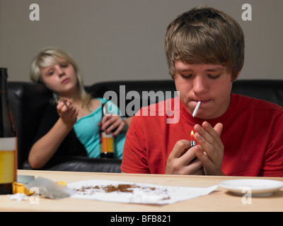 Teenage Couple Taking Drugs At Home Stock Photo