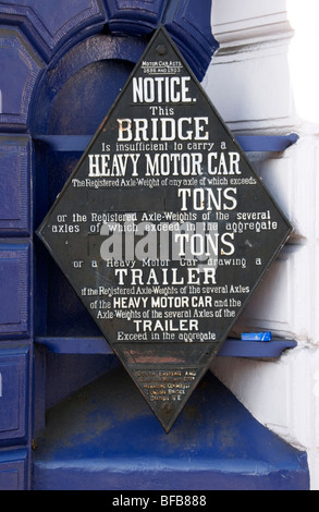 An old weight restriction sign on Blackheath railway bridge, South London Stock Photo