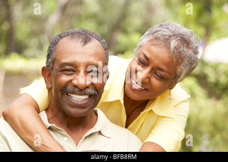 Senior Couple Outdoors Hugging Stock Photo