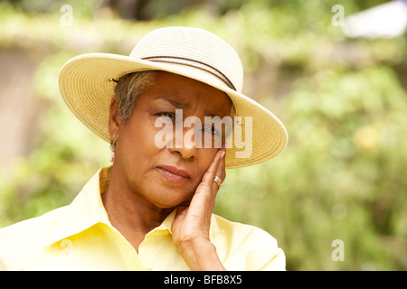 Senior Woman With Thoughtful Expression Stock Photo