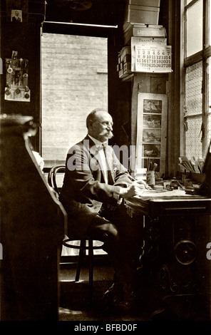 Old Businessman Working in Office Stock Photo