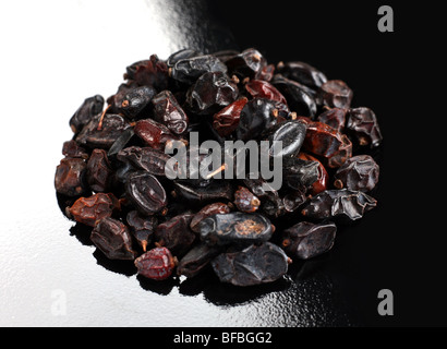 Barberry spice round heap closeup on black white background Stock Photo