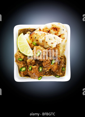 Dish with tasty beef curry on dark background, closeup Stock Photo - Alamy