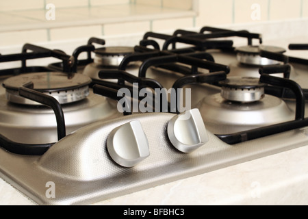 Element management on metal stove in kitchen Stock Photo