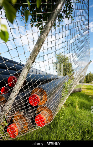 Insulated pipes used for delivering heated water from the power plant plant to households in district heating system , Finland Stock Photo