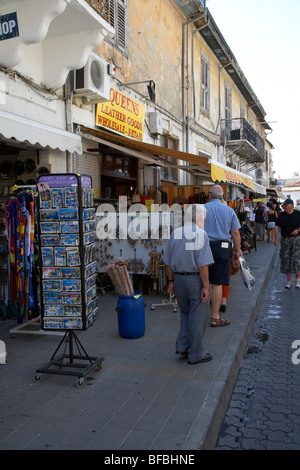 tourists shopping in souvenir shops in the old town Limassol lemesos republic of cyprus europe Stock Photo