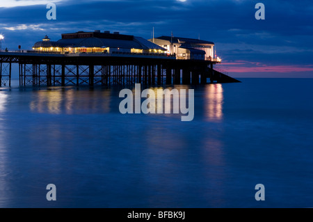 The pavilion at the end of Cromer Pier with lights at twilight. Stock Photo