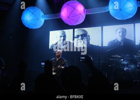 The Pixies play live at the Hollywood Palladium, projection screen of their faces behind them on stage, Doolittle reunion tour Stock Photo