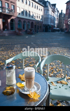 Autumn in the city in an italian ice cafe. View across the square Stock Photo