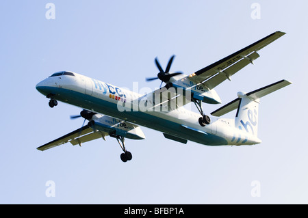 Bombardier Dash 8 operated by Flybe on approach for landing at Birmingham Airport Stock Photo