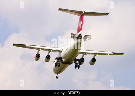 Avro RJ100 operated by Swiss International Air Lines on approach for landing at Birmingham Airport Stock Photo