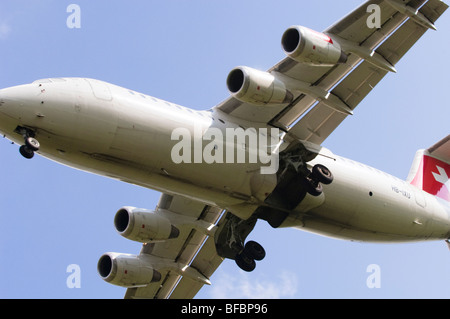 Avro RJ100 operated by Swiss International Air Lines on approach for landing at Birmingham Airport Stock Photo