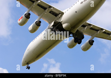 Avro RJ100 operated by Swiss International Air Lines on approach for landing at Birmingham Airport Stock Photo