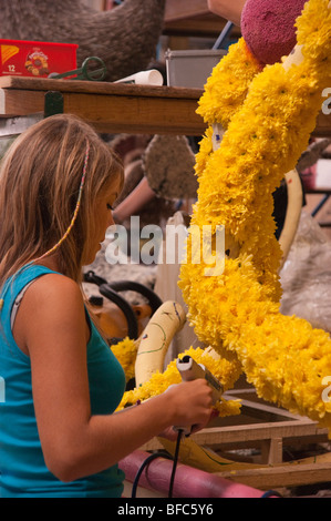 Jersey 2009 Battle of the Flowers preparation - fixing flowers to the float statues and figures Stock Photo