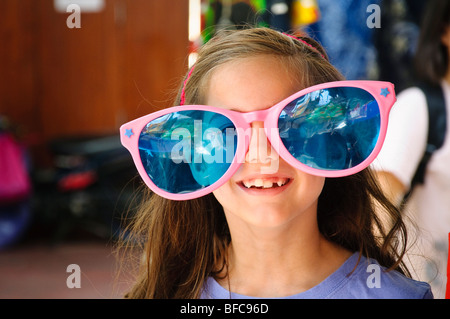 Girl wearing over sized  sun glasses Stock Photo