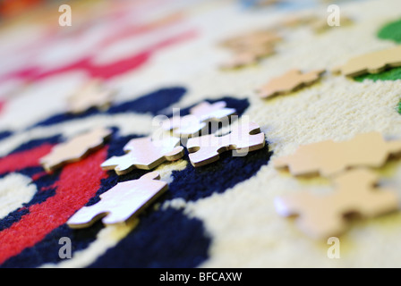 Puzzle pieces on a carpet in a room of a child Stock Photo