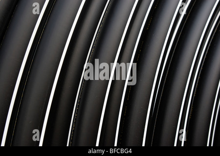 Spools of solid wall high density polyethylene (HDPE) conduit. Stock Photo