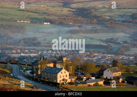The Cow and Calf hotel on Ilkley Moor and the town of Ilkley are bathed in dawn light, Ilkley, West Yorkshire, UK Stock Photo