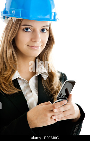 Beautiful female architect using a cellphone isolated on white Stock Photo
