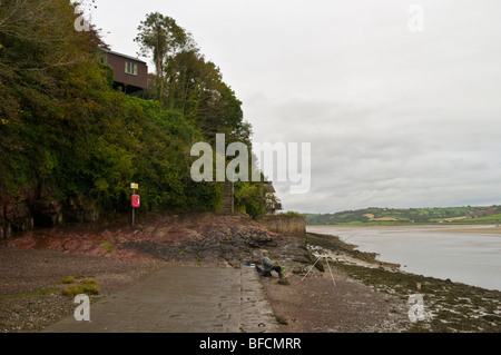 The River Taf with Dyan Thomas's Writing Shed (a converted garage) on the cliff side. Stock Photo