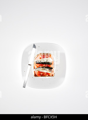 Sardines and skinned tomato on toast, with cracked pepper. Stock Photo