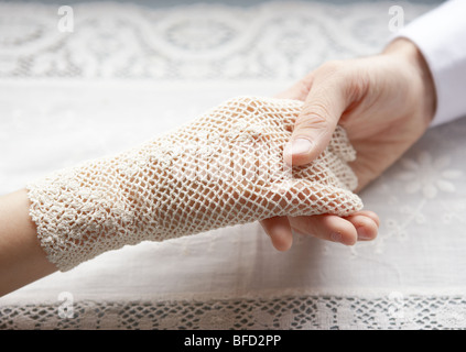 Bridal couple holding hands Stock Photo