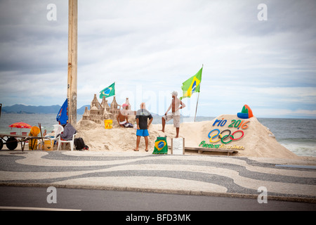 artists making sand sculptures on Copacabana beach Stock Photo