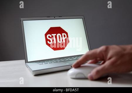 Stop sign on computer sign Stock Photo