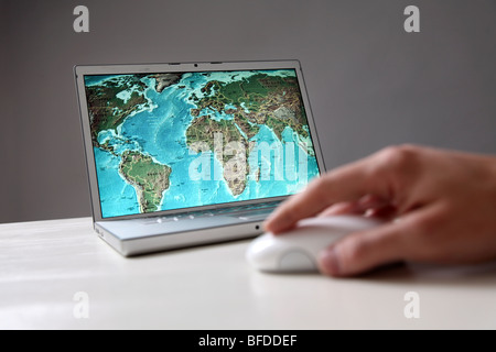 World map on computer screen Stock Photo