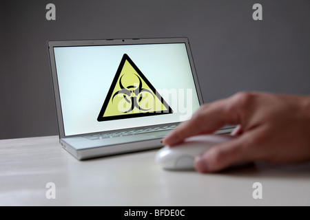 Biohazard sign on a computer screen. Symbol: computer virus, worm, etc Stock Photo