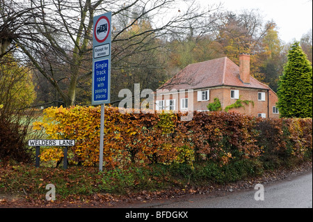 Quaker meeting house and single track road sign at the junction of Welders Lane and Jordans Lane Bucks UK Stock Photo