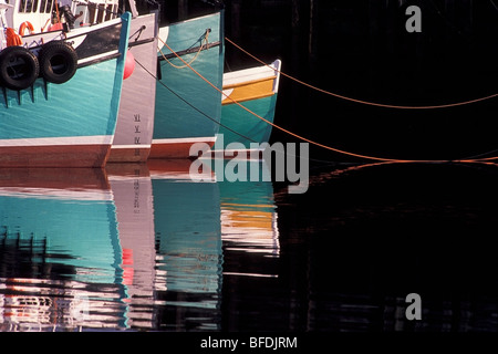 Fishing boats and their reflections in water, North Head, Grand Manan Island, New Brunswick, Canada Stock Photo