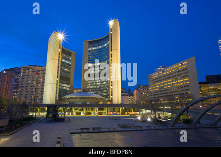 City Hall building and the Nathan Phillips Square at dusk in downtown Toronto, Ontario, Canada Stock Photo