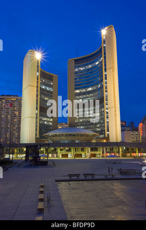 City Hall building and the Nathan Phillips Square at dusk in downtown Toronto, Ontario, Canada Stock Photo