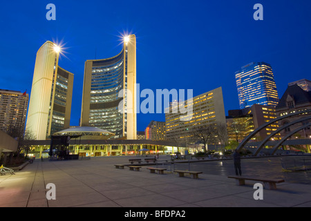 City Hall building and the Nathan Phillips Square at dusk in downtown Toronto, Ontario, Canada Stock Photo