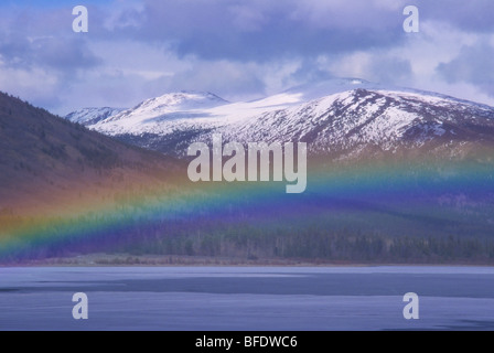 Rainbow over Surprise Lake, Atlin, British Columbia, Canada Stock Photo