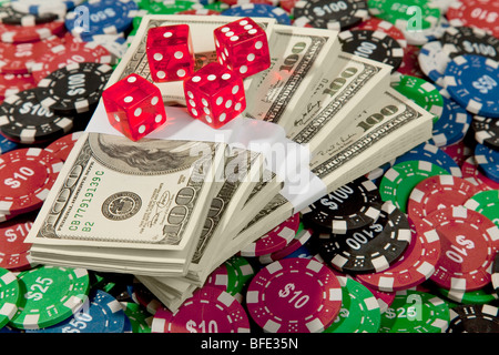 Money, Dice and Poker Chips on a green felt poke table Stock Photo
