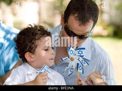 Young boy holding national flags. Stock Photo