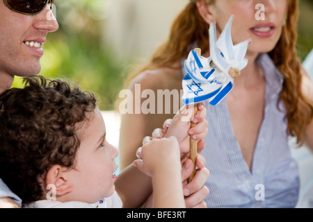 Young boy holding national flags. Stock Photo