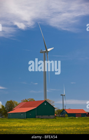 Eco-friendly wind turbines with rural barns on the Bruce Peninsula, Ontario, Canada Stock Photo